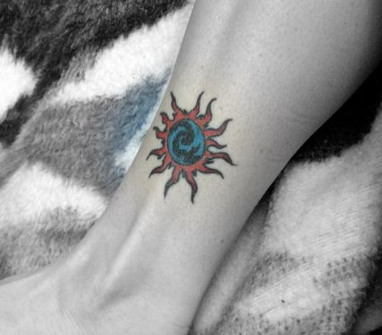 Tribal Sun Leg Tattoo